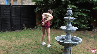 Half-stripped, Bell-jingling Slave Mila Drooling Through Tongue Clamp Is Made to Walk Outdoor Fountain Laps with Crotch Rope Saw