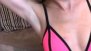 Stunning Brunette in Sexy Neon Pink Bikini and Leather Boots Ballgags Herself