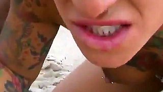 She has just turned eighteen and Baby Reed with her shaved pussy and tattooed wants to enjoy a hard cock on a beach