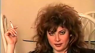 Classic early 90's smoking with big hair, perfect.