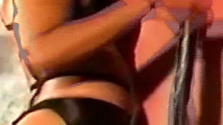 Brunette Dominatrix Teases Her Masked Caged Slave
