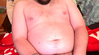 Chubby boy jerks off in bed