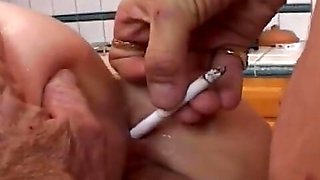 Dirty Slut Smokes While Older Man Licks and Pumps Her Pierced Pussy on the Kitchen Table