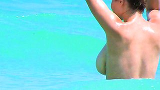 Smoothest nudist play in the warm water  at a nudist beach