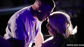 Blonde April Paisley stripper sucks him under purple club lights