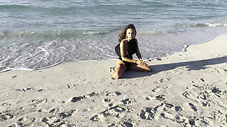 Sexy Monika Fox in Black Bodysuit on Beach