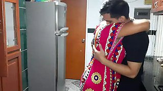 My stepmother gives me a blowjob in the kitchen