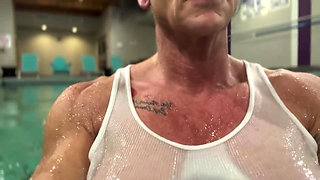 Amazon Kandy Flexes Her Massive Biceps in Her Hotel Pool