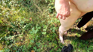 Whipping her vagina in the woods