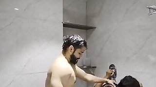 Bearded Indian dude fucks a Desi MILF in the shower from the back