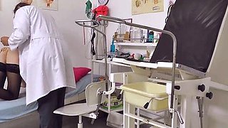 Hot brunette in stockings fingering and toying pussy