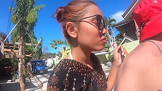 Asian cutie in a bikini gives sensual POV handjob and sloppy BJ on the sunny Thai beach