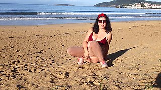 Woman Pissing on a Public Beach While No One Is There