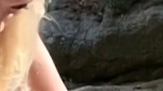 Horny couple fucking on the end of a beach