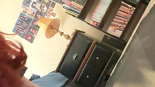 Curvy redhead riding dildo