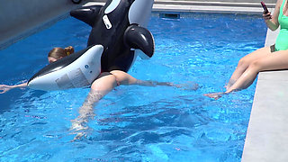 Lesbian Girls Are Having Fun in a Pool with an Inflatable Shark