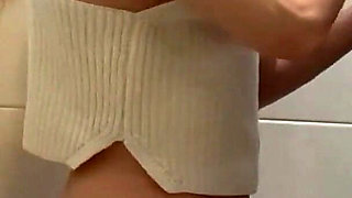 Busty Blonde Sucks Cock in the School Bathroom