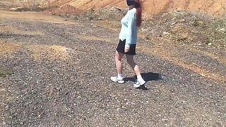 Girl undresses on a windy day